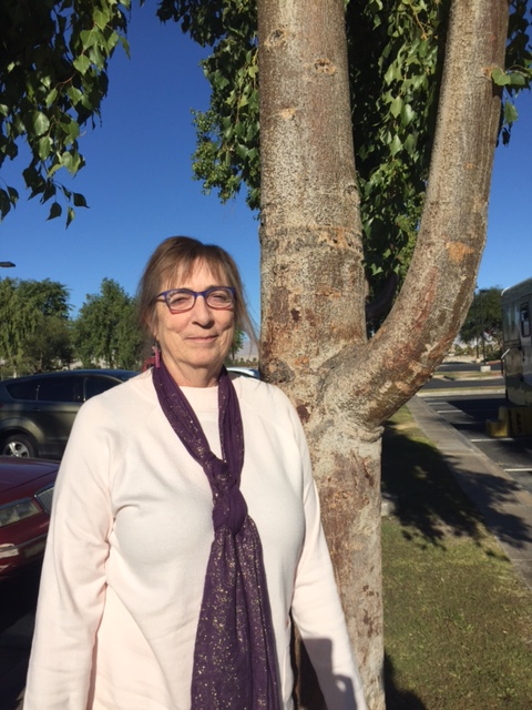 Betty Voran in front of tree