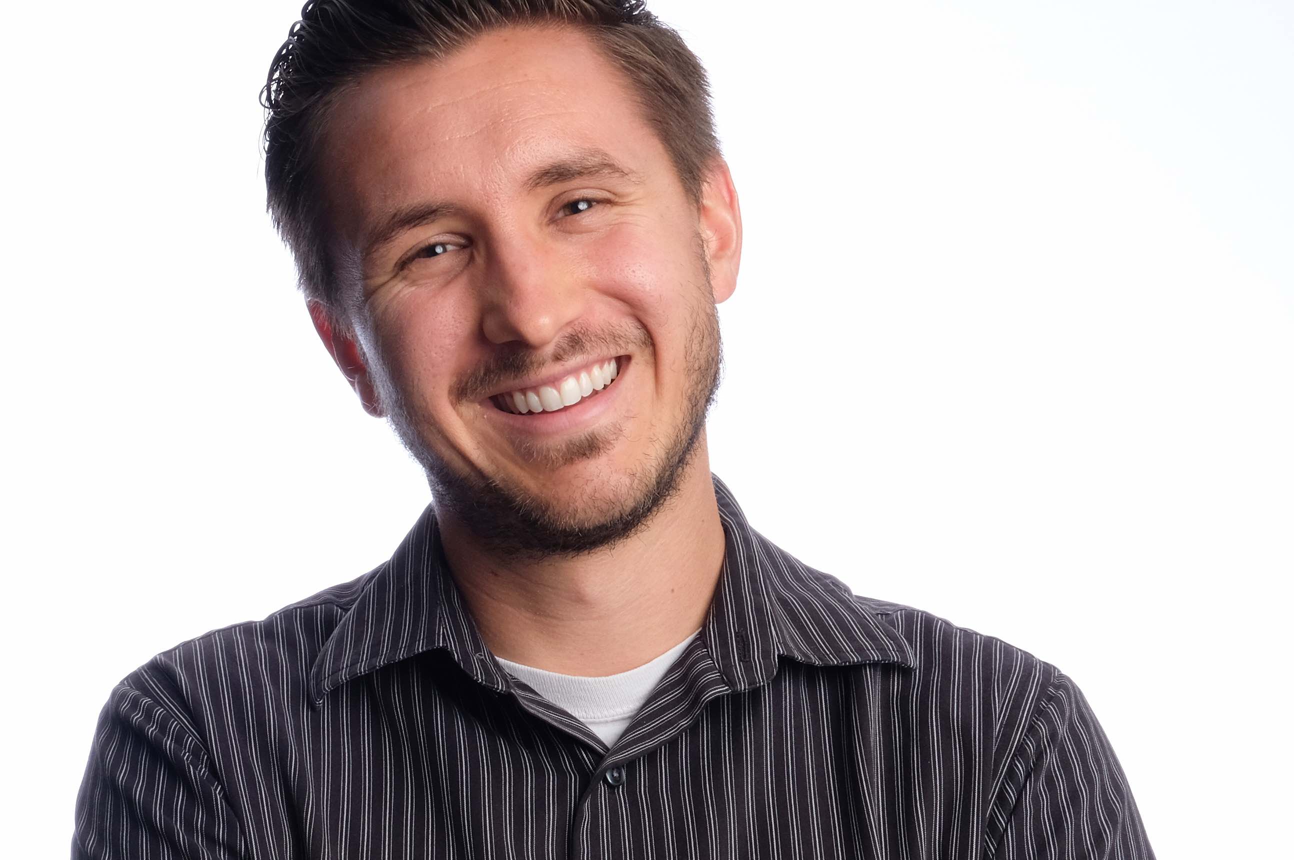 Matt Gush portrait smiling against a white background