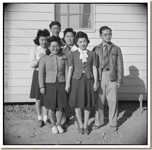 George Fujii standing with other internees at Poston Camp