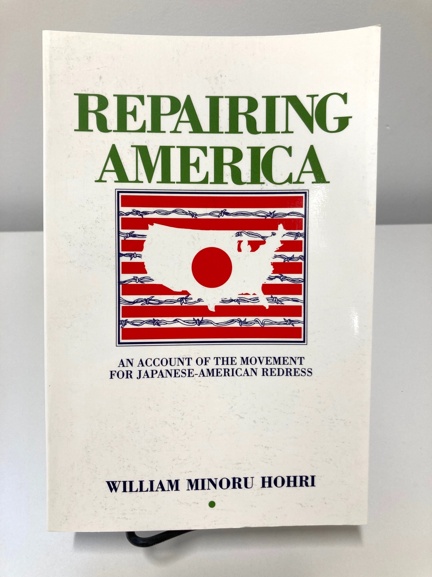 Repairing America book cover with United States outline over image of barbed wire 